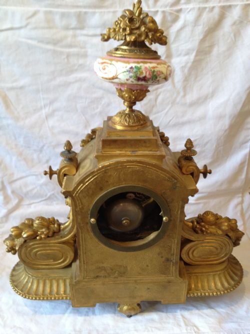 A LOUIS XVI ORMOLU MANTLE CLOCK WITH SEVRES PANELS View II