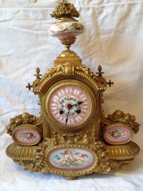 A LOUIS XVI ORMOLU MANTLE CLOCK WITH SEVRES PANELS View V