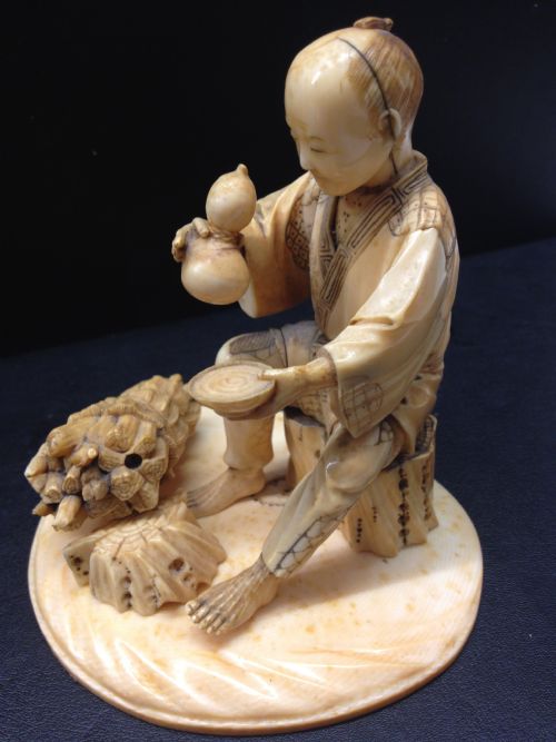 fig 1. JAPANESE IVORY OKIMONO WOODMAN MEIJI PERIOD 1868-1912
