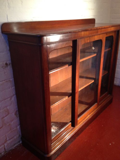 fig 3. VICTORIAN MAHOGANY TRIPLE SLIDING DOOR BOOKCASE