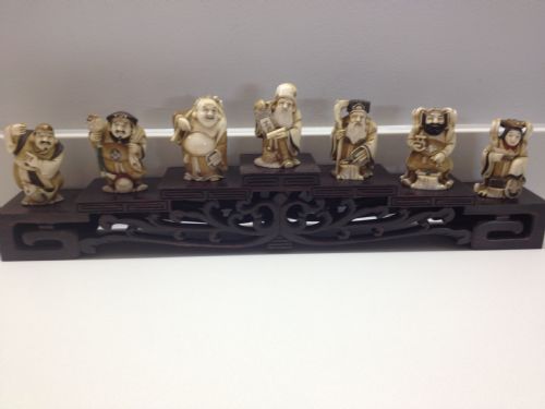 7 Japanese Ivory Okimono with Stand of Chinese Gods
