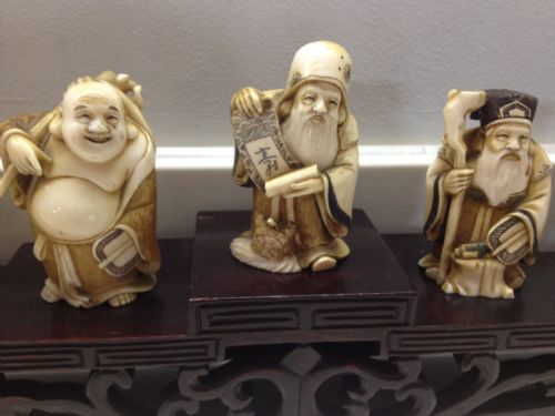 7 JAPANESE IVORY OKIMONO WITH STAND OF CHINESE GODS View III