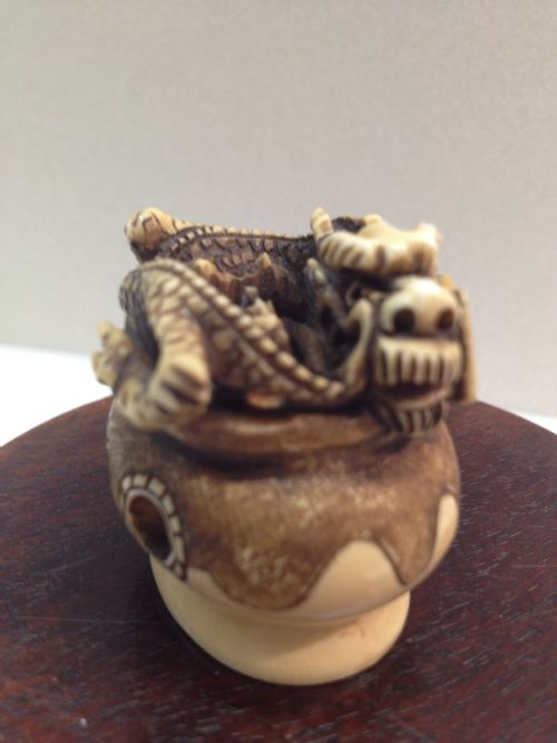 fig 1. JAPANESE IVORY NETSUKE DRAGON RISING FROM CENSOR MEIJI PERIOD