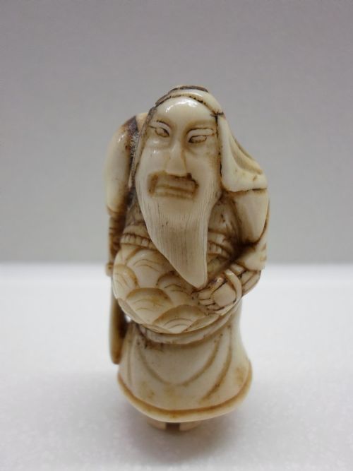 fig 1. 19TH CENTURY JAPANESE STAGHORN NETSUKE BEARDED SAGE