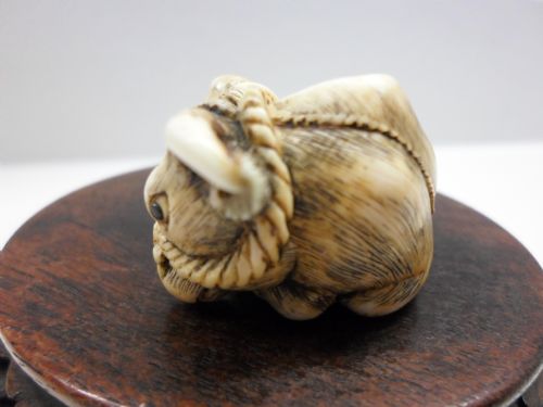 fig 1. JAPANESE IVORY NETSUKE OX SIGNED TOMOTADA SCHOOL