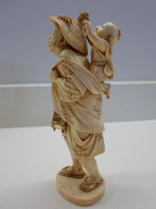 fig 1. JAPANESE IVORY OKIMONO FATHER AND SON CATCHING CRICKETS