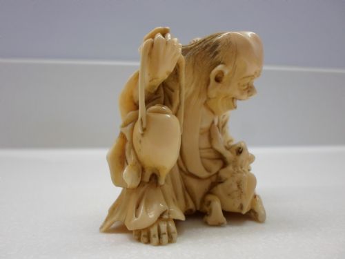 fig 1. HUMEROUS JAPANESE IVORY OKIMONO HOTEI AND TOADS