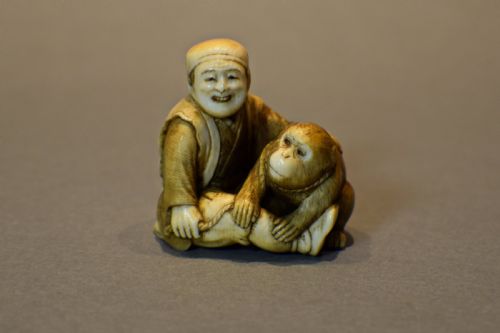 a charming japanese ivory okimono of a seated monkey sarumawashi signed - CATEGORY: ANTIQUE MISCELLANEOUS - DATED 1900
