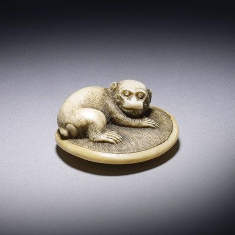a charming japanese edo period ivory netsuke monkey upon on a zabuton - CATEGORY: ANTIQUE MISCELLANEOUS - DATED 1800