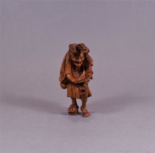 A WELL CARVED JAPANESE CARVED WOODEN NETSUKE ABURA BOZU THE OIL THIEF - ADDITIONAL PHOTO 1