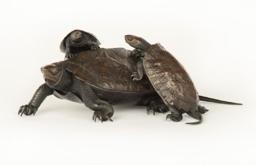 fig 1. A Japanese bronze sculpture depicting a large turtle with two smaller turtles crawling on its shell.