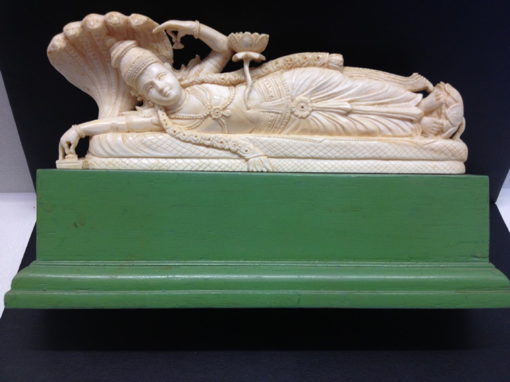 FINE QUALITY INDIAN IVORY RECLINING GODDESS ON STAND View II