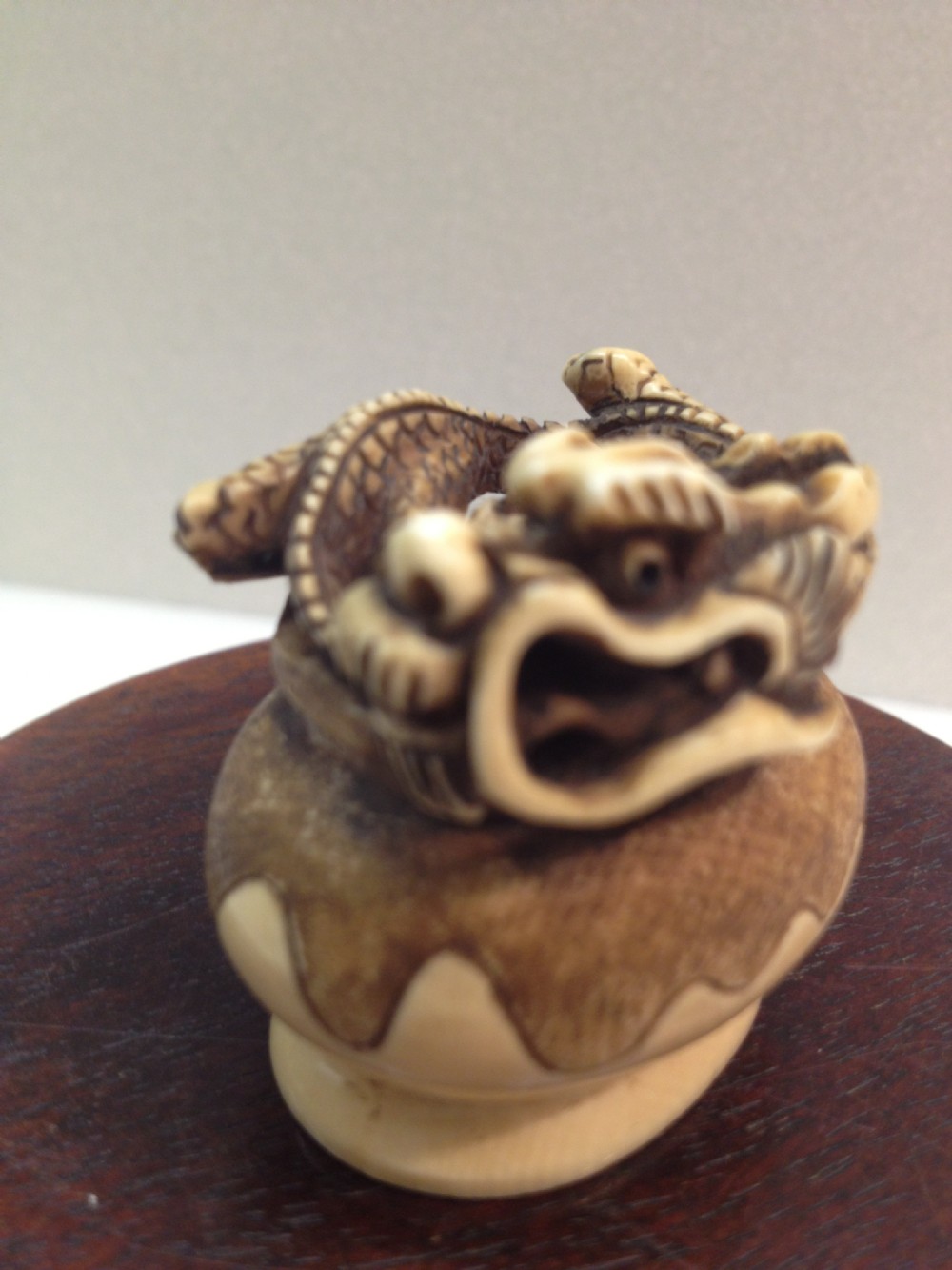 JAPANESE IVORY NETSUKE DRAGON RISING FROM CENSOR MEIJI PERIOD View III