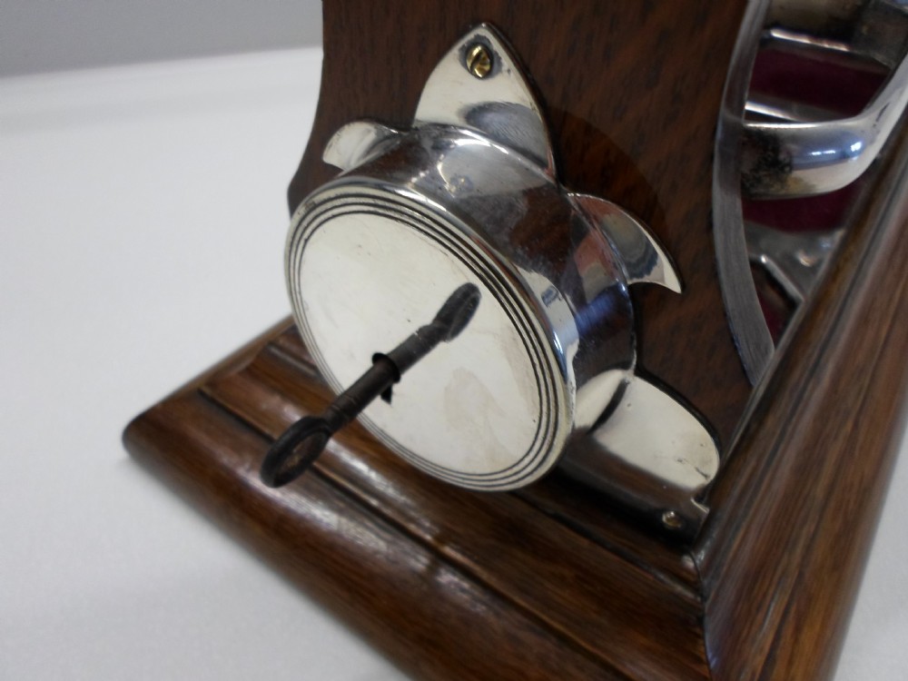 UNUSUAL WALKER AND HALL TIGER OAK AND SILVER PLATED TANTALUS - HOLD FAST PATENT  View VIII