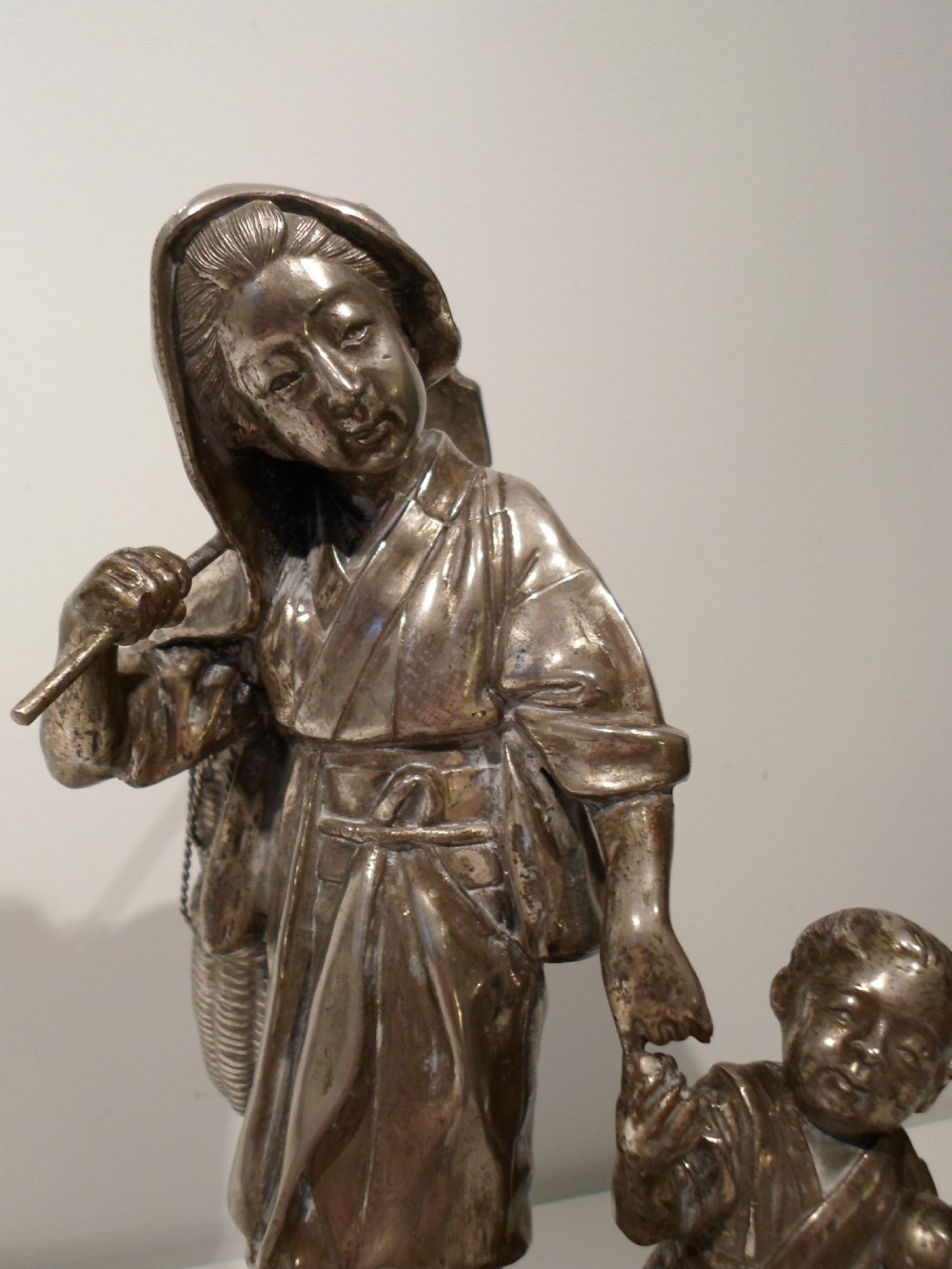 FINE QUALITY JAPANESE SILVERED OKIMONO FEMALE WORKER WITH BOY - SIGNED  View V