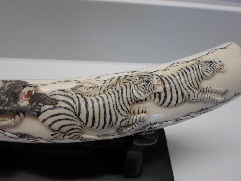 JAPANESE IVORY TUSK ON STAND LIONS AND ZEBRA View V