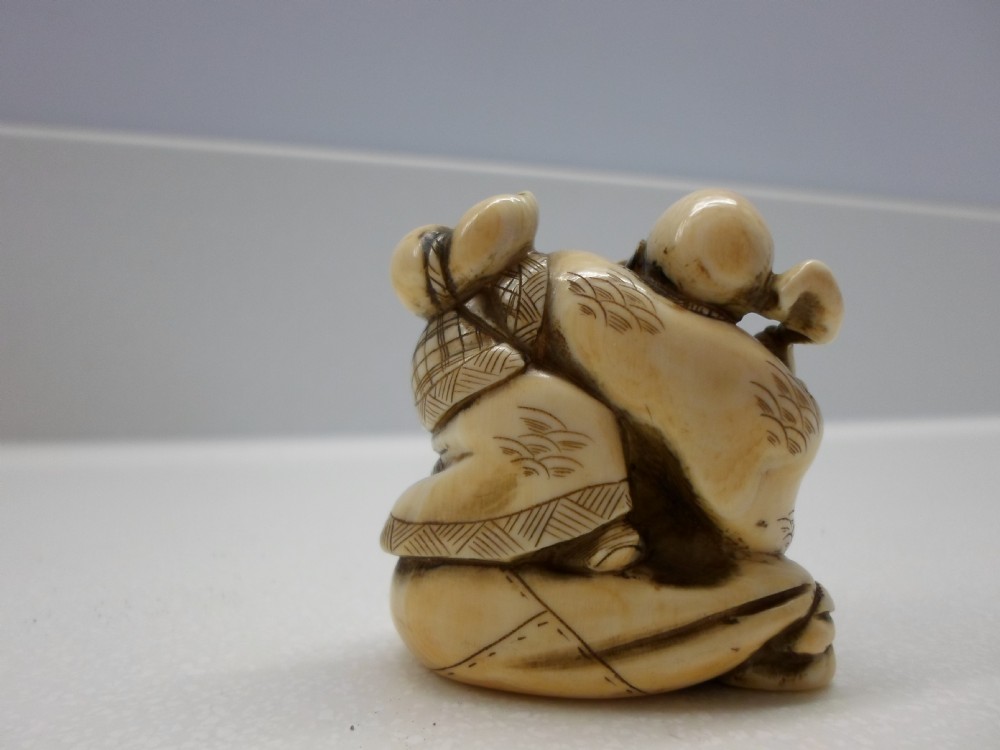 JAPANESE SIGNED IVORY NETSUKE OF AN ELDER  View III