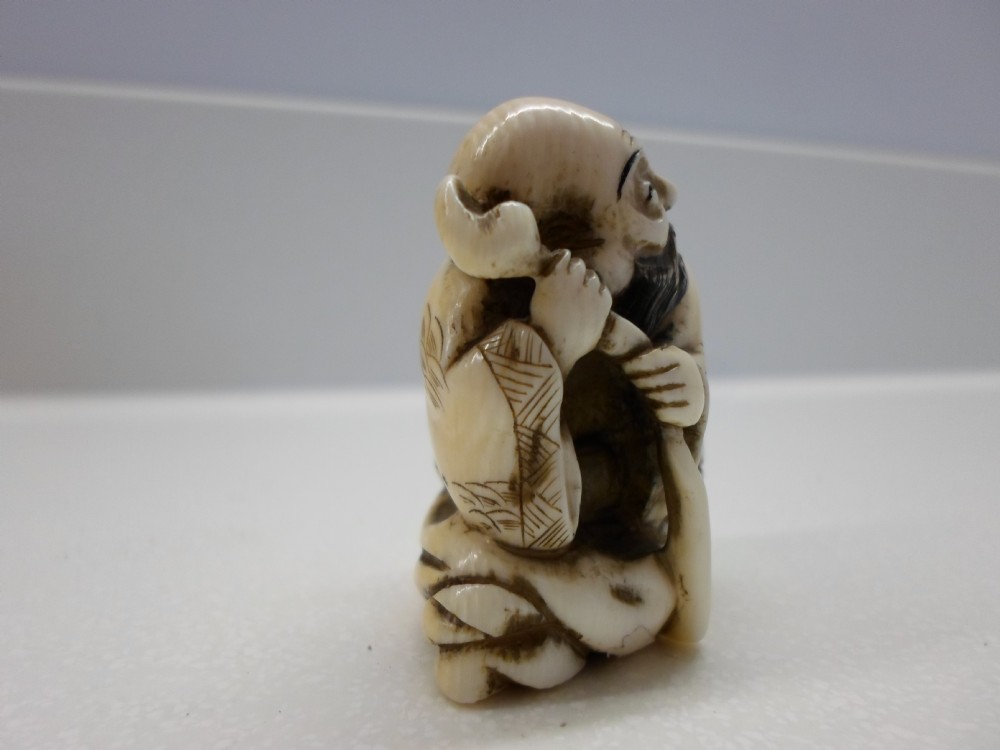 JAPANESE SIGNED IVORY NETSUKE OF AN ELDER  View IV