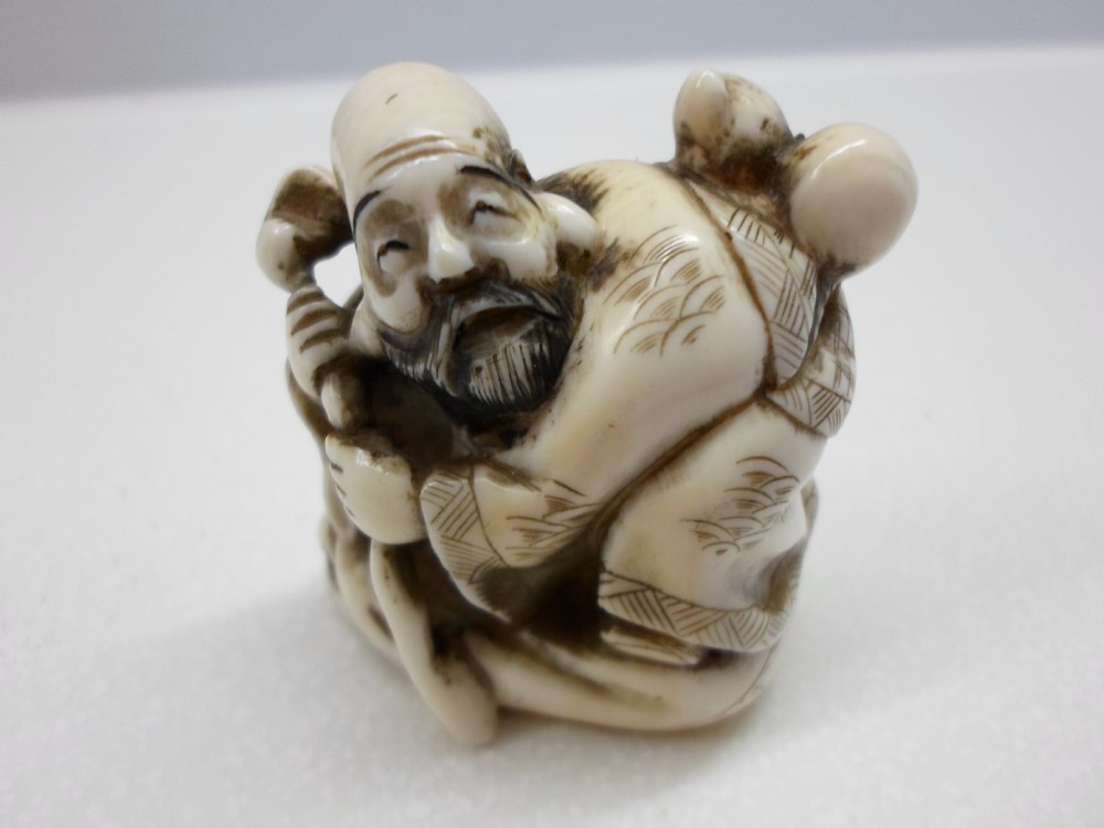 JAPANESE SIGNED IVORY NETSUKE OF AN ELDER  View VI
