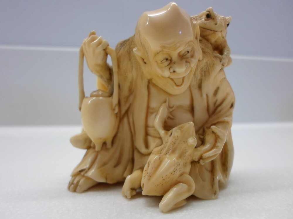 HUMEROUS JAPANESE IVORY OKIMONO HOTEI AND TOADS