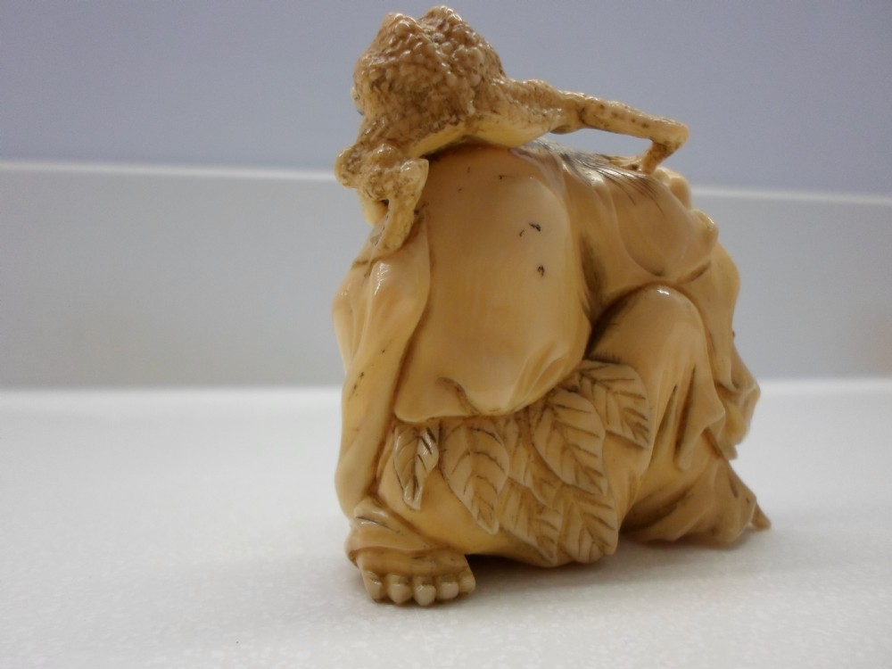 HUMEROUS JAPANESE IVORY OKIMONO HOTEI AND TOADS View IV