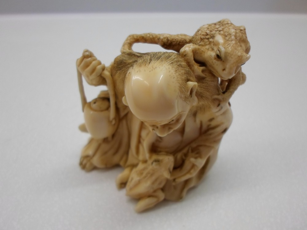 HUMEROUS JAPANESE IVORY OKIMONO HOTEI AND TOADS View VI