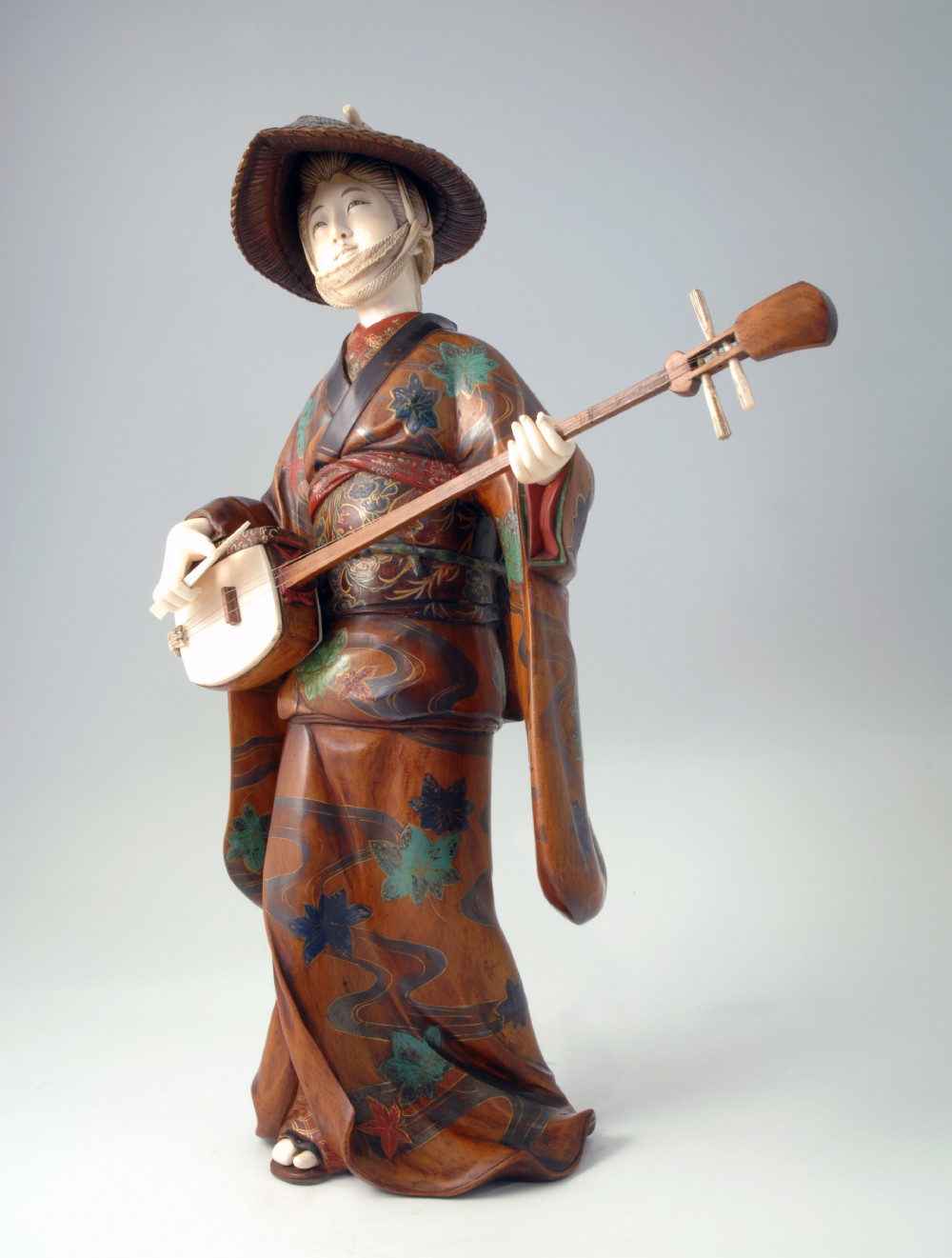 LARGE JAPANESE WOOD AND IVORY OKIMONO MUSICIAN View II