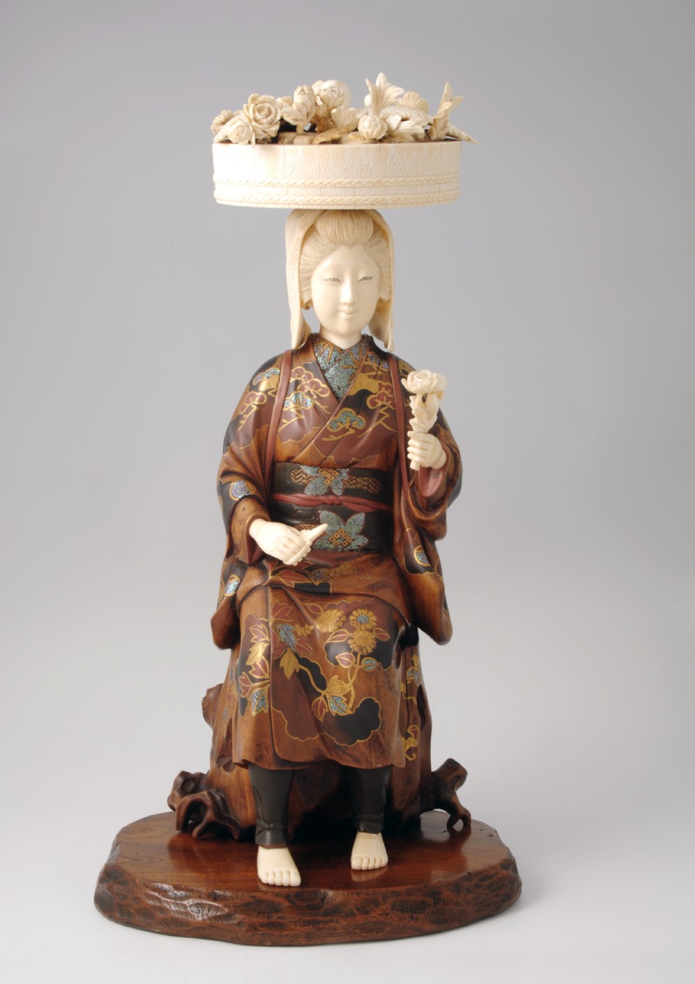 CHARMING JAPANESE WOOD AND IVORY OKIMONO FLOWER SELLER