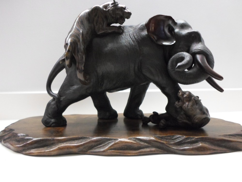 A LARGE JAPANESE BRONZE ELEPHANT AND TIGER GROUP BY SEIYA View II