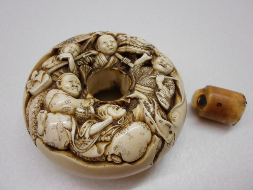AN OVERSIZED JAPANESE IVORY MANJU NETSUKE SIGNED TOMOCHIKA View VII