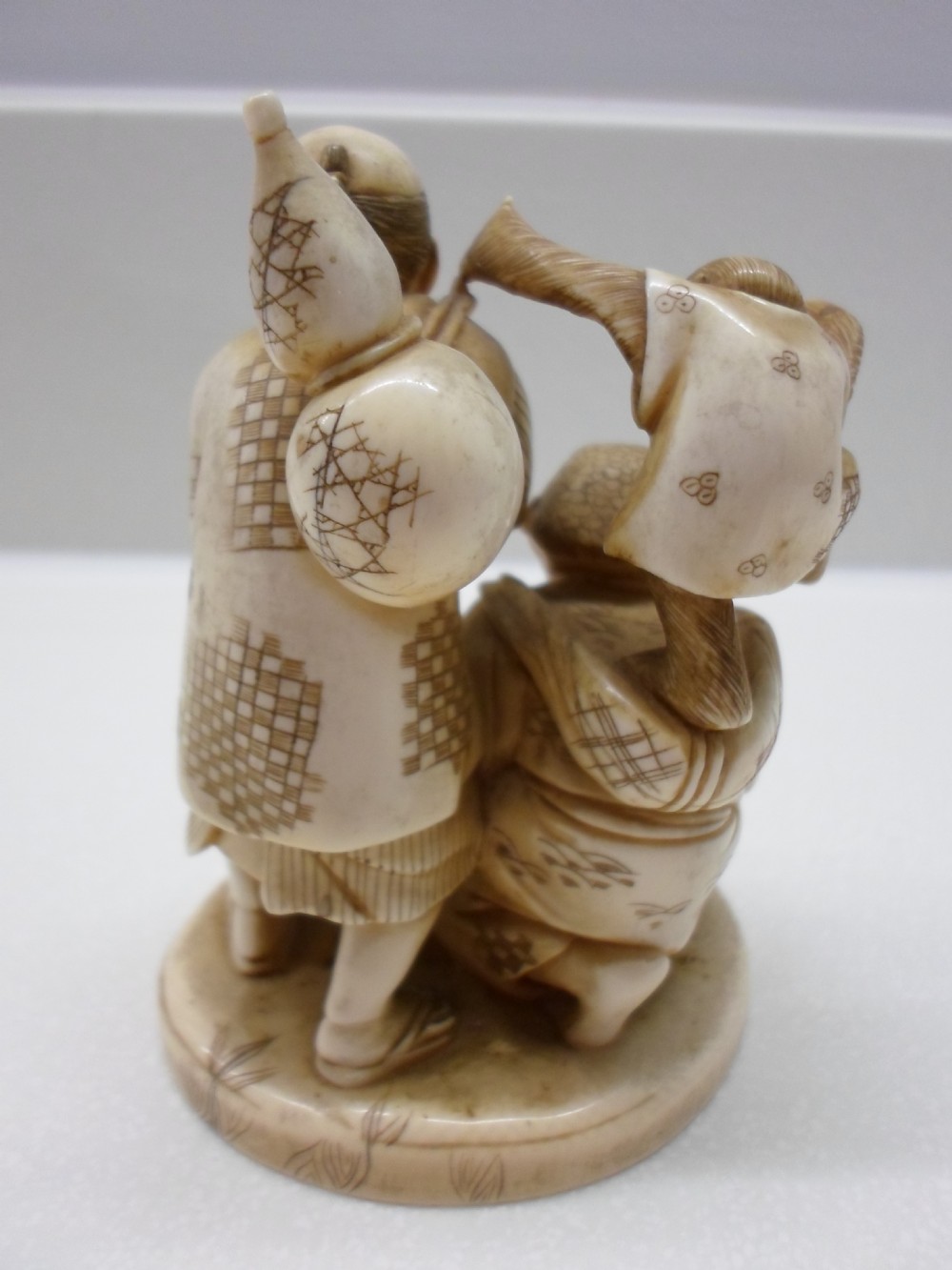 COMICAL JAPANESE ONE PIECE IVORY GROUP MONKEY TRAINERS View III