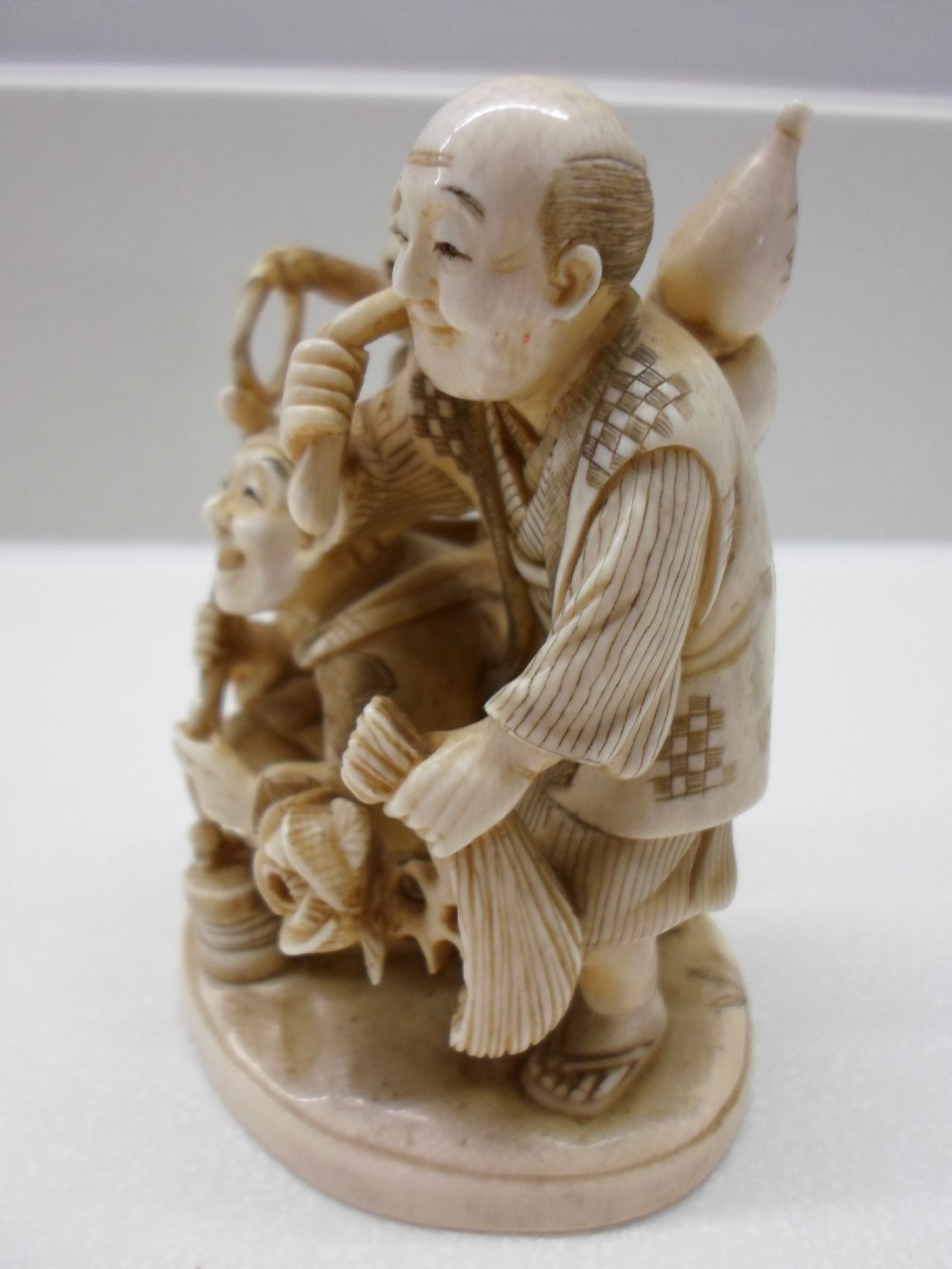 COMICAL JAPANESE ONE PIECE IVORY GROUP MONKEY TRAINERS View IV