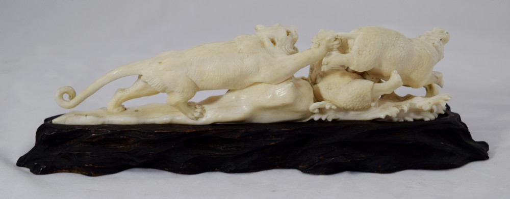 FINE QUALITY JAPANESE IVORY OKIMONO LIONESS AND HIPPO'S View II