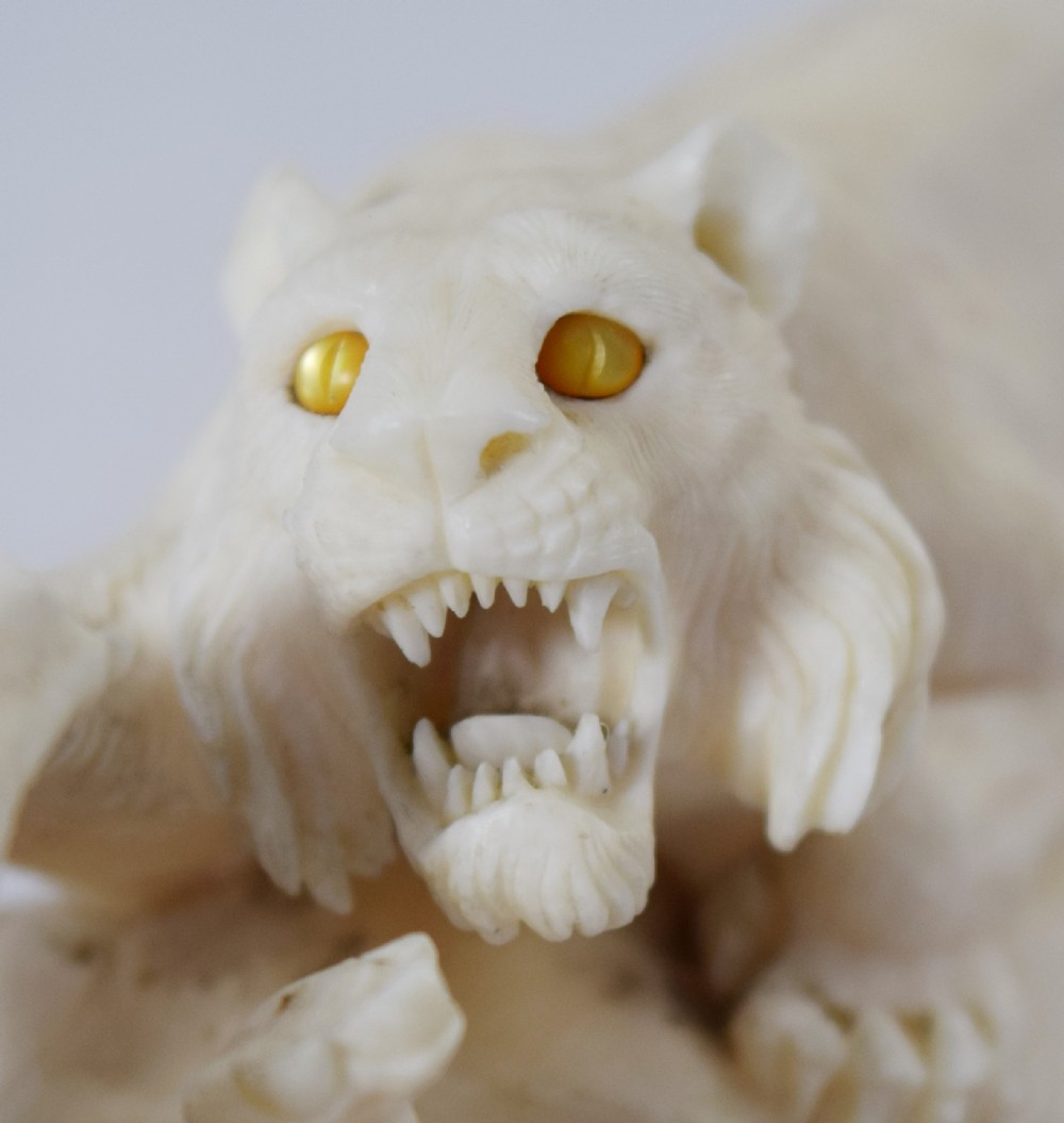 FINE QUALITY JAPANESE IVORY OKIMONO LIONESS AND HIPPO'S View V