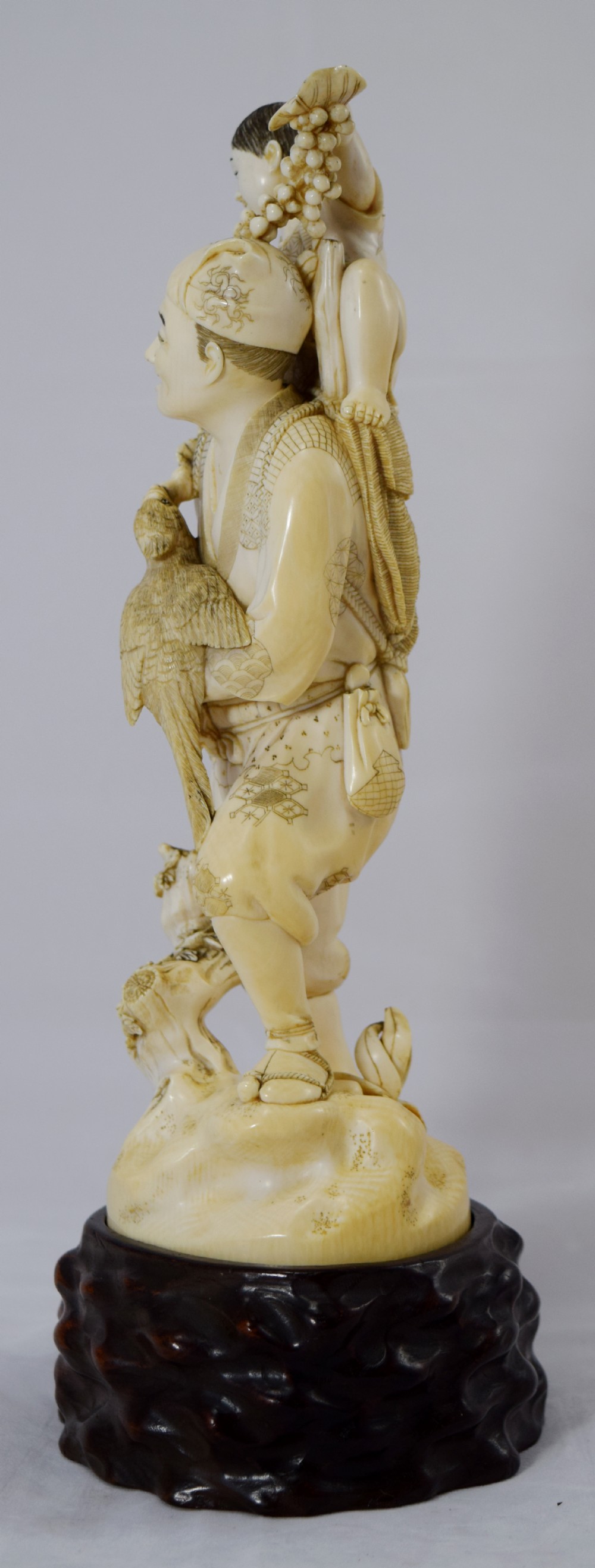 LARGE JAPANESE IVORY OKIMONO ON STAND FATHER SON AND COCKATIEL View II