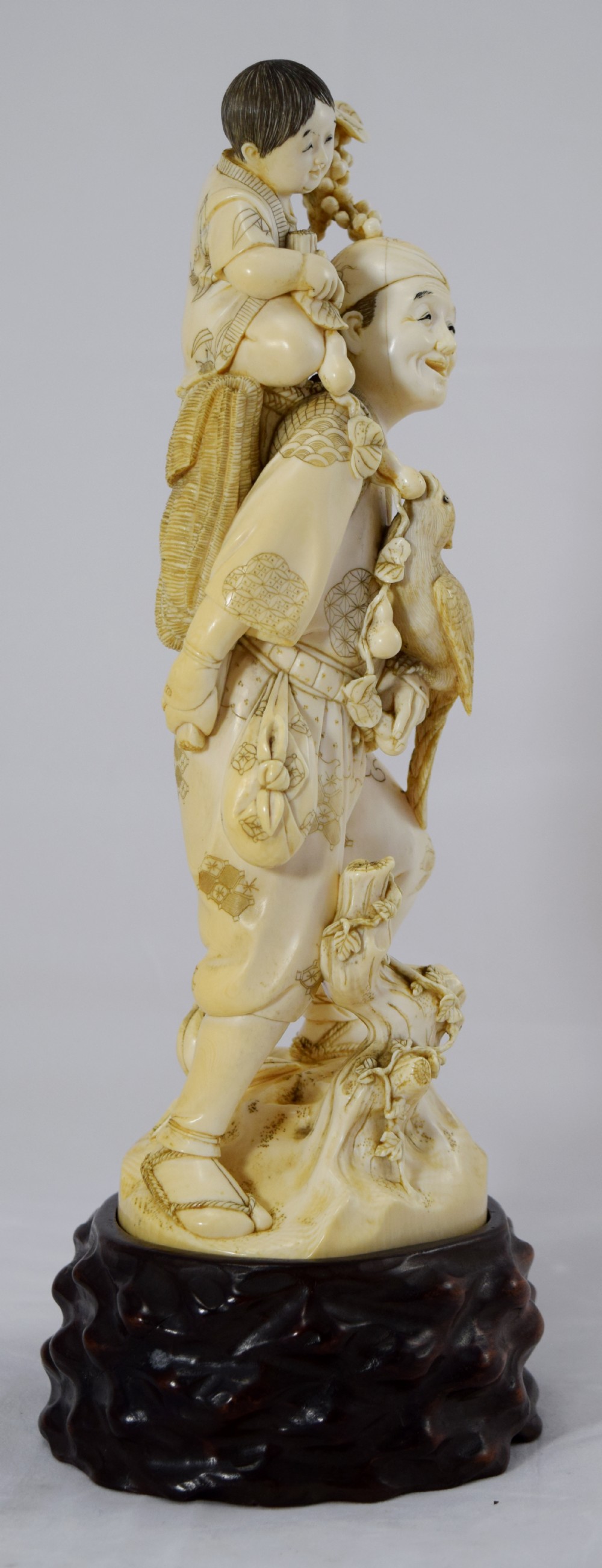 LARGE JAPANESE IVORY OKIMONO ON STAND FATHER SON AND COCKATIEL View IV