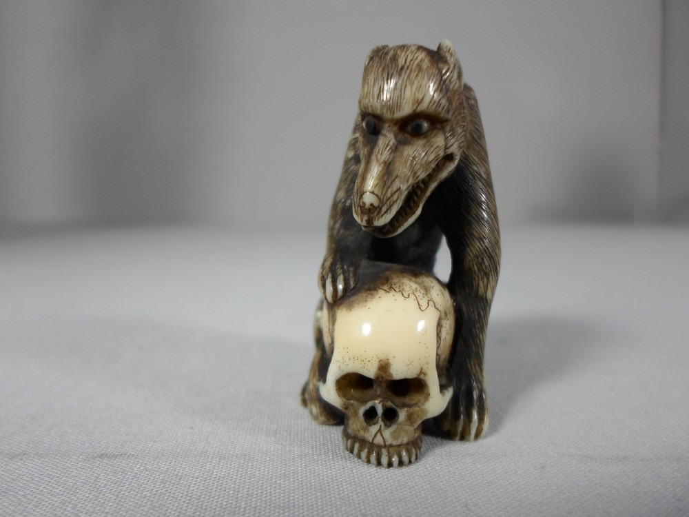 FINE AND UNUSUAL JAPANESE IVORY NETSUKE WOLF AND SKULL View VI