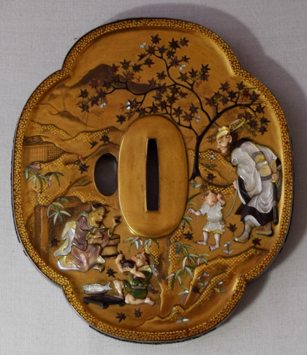 A JAPANESE GOLD LACQUER TSUBA SHAPED PLAQUE BY NEMOTO View II