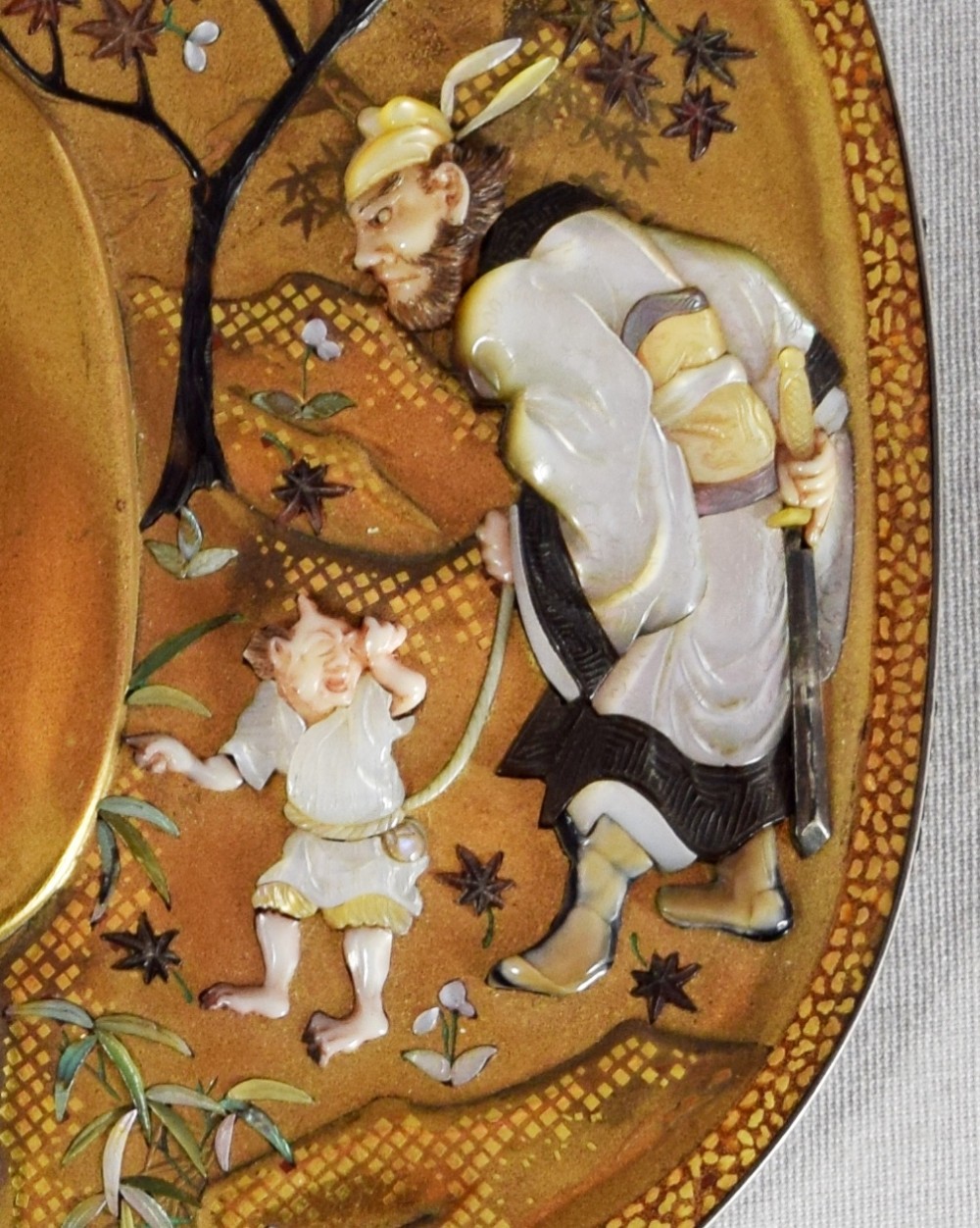 A JAPANESE GOLD LACQUER TSUBA SHAPED PLAQUE BY NEMOTO View IV