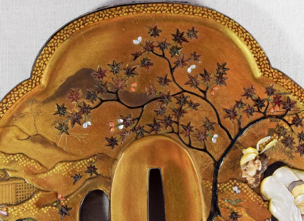 A JAPANESE GOLD LACQUER TSUBA SHAPED PLAQUE BY NEMOTO View V