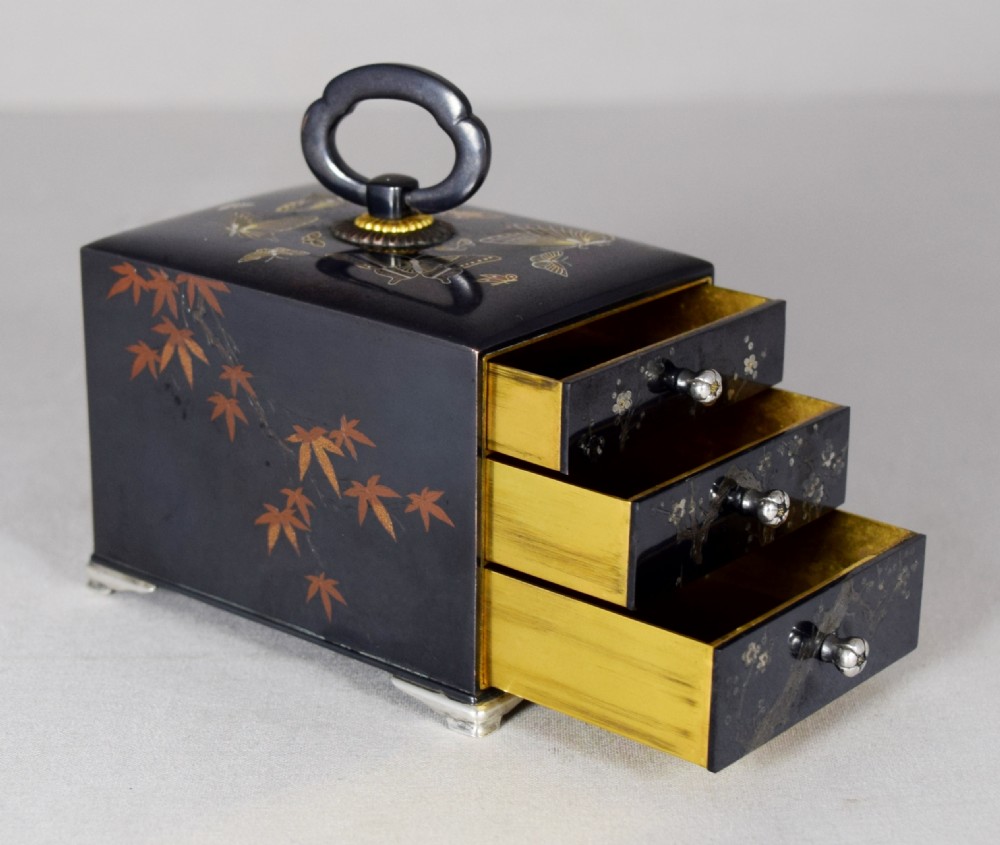 A FINE AND RARE MINIATURE SHAKUDO KODANSU BY NOGAWA View VI