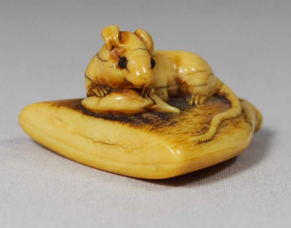 DELIGHTFUL JAPANESE RAT ON A BROOMHEAD IVORY NETSUKE View II