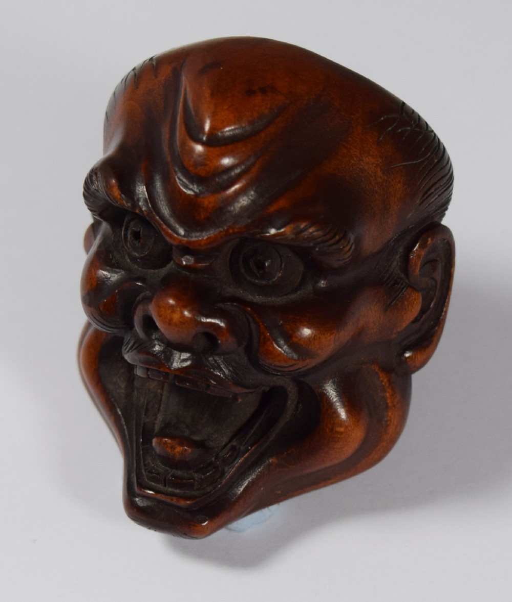 A WELL CARVED JAPANESE BOXWOOD NOH MASK OKIMONO  View II