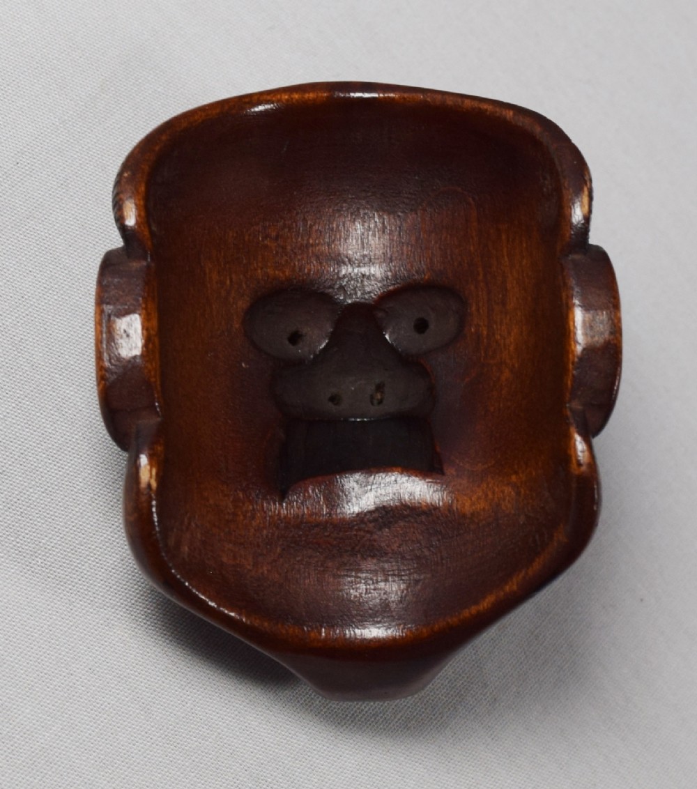 A WELL CARVED JAPANESE BOXWOOD NOH MASK OKIMONO  View V