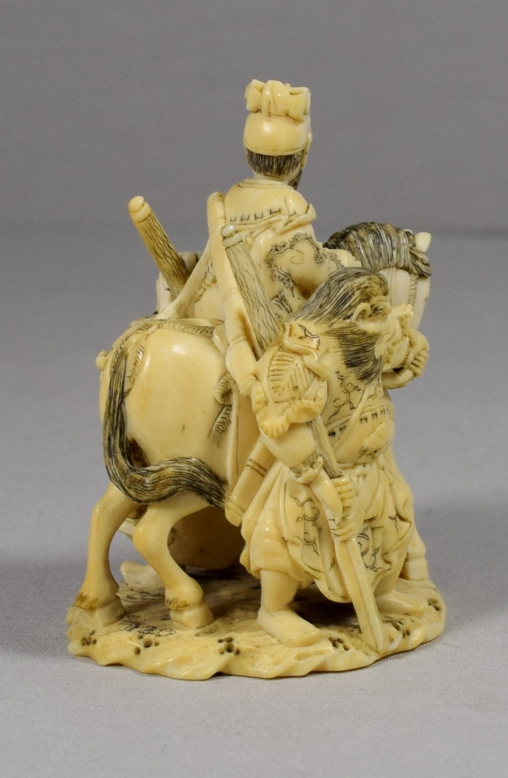 JAPANESE IVORY OF A NOBLEMAN ON HORSEBACK WITH SAMURAI View IV