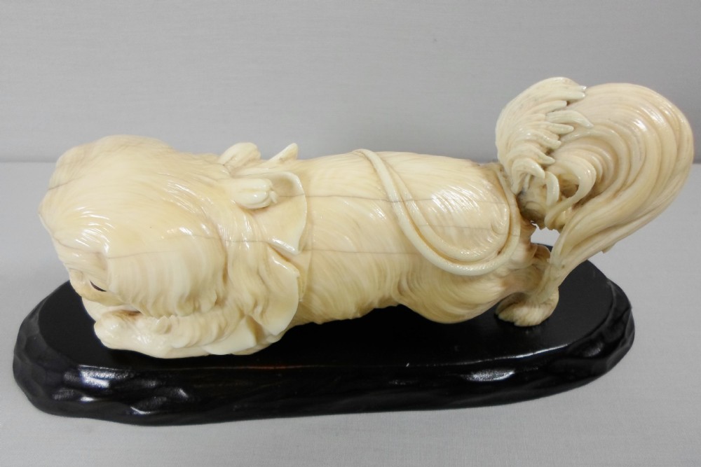 A CHARMING JAPANESE IVORY OKIMONO OF A PEKINGESE DOG View VI