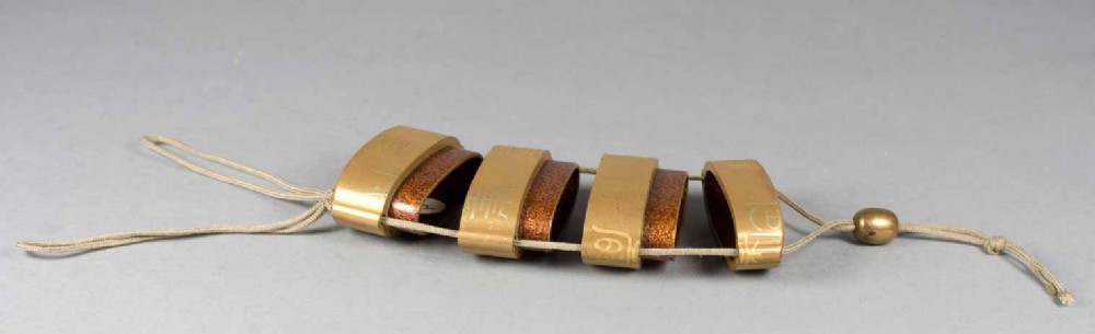 A JAPANESE THREE CASE SIGNED GOLD LACQUER INRO View III