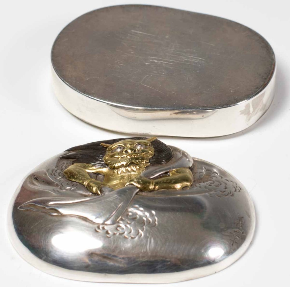 A SOLID SILVER JAPANESE  BOX AND COVER DEPICTING SHOKI View V