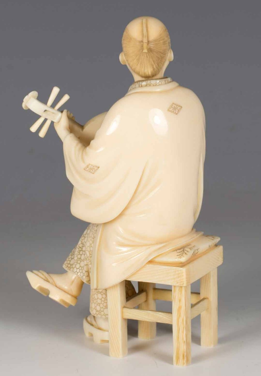 A FINE QUALITY JAPANESE IVORY OKIMONO MUSICIAN View IV