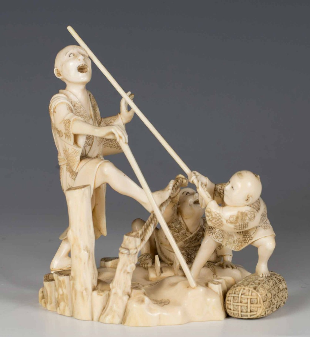 HUMEROUS JAPANESE IVORY OKIMONO GROUP SIGNED GYOKUSUI View II